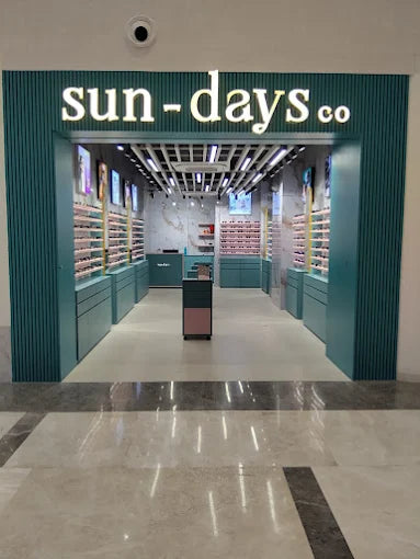 Store entrance with 'sun-days.co' sign in a modern interior setting